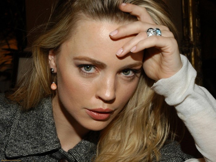 Melissa George with hand on forehead