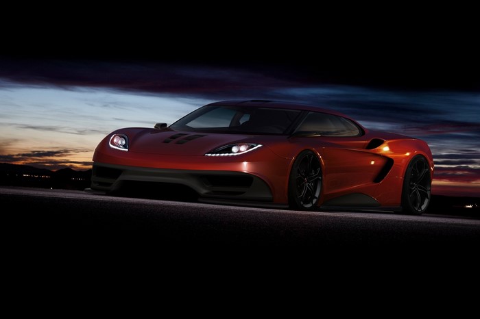 Red McLaren sports car on a road at dusk