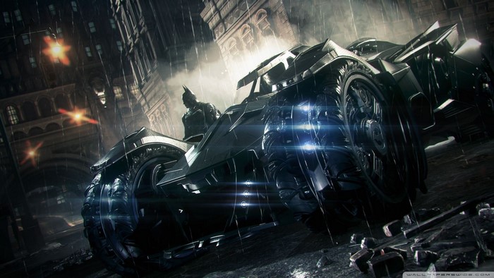 Batman in the Batmobile during a rainy night