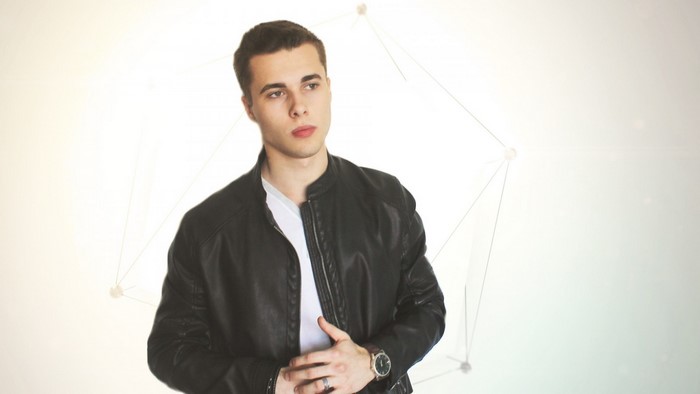 Man in leather jacket posing