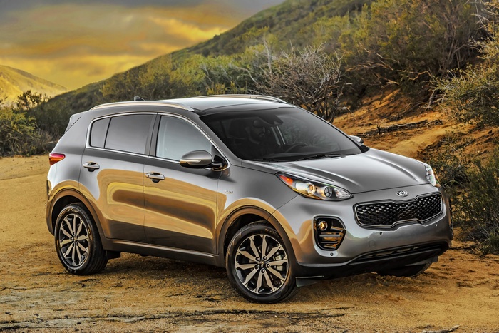 Silver Kia Sportage EX parked on dirt road