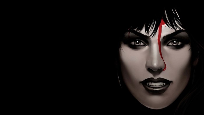 Close-up of a vampire woman with blood on her face