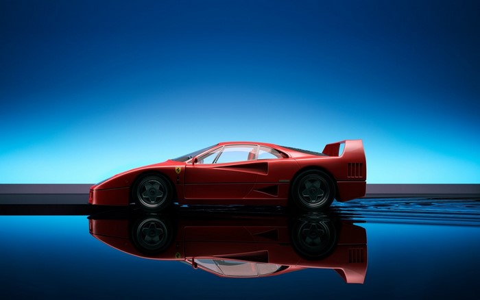 Red Ferrari F40 sports car reflected in water