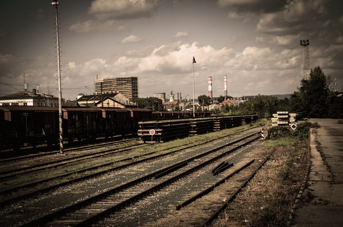 Abandoned train yard with industrial buildings