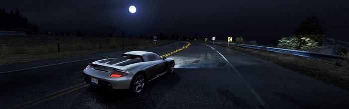 Porsche Carrera GT driving on a road at night in Need for Speed Hot Pursuit