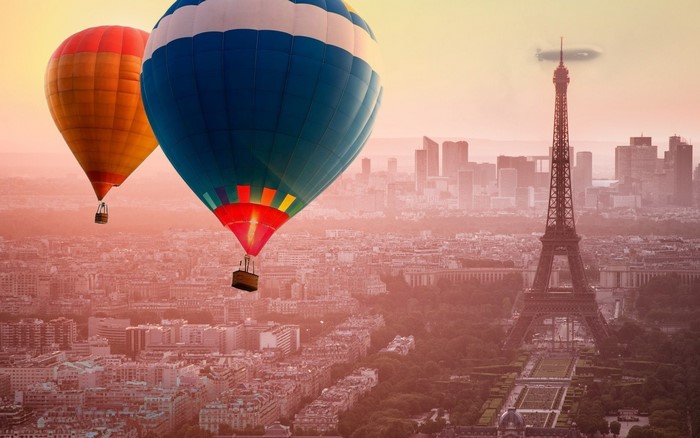 Hot air balloons over Paris with Eiffel Tower
