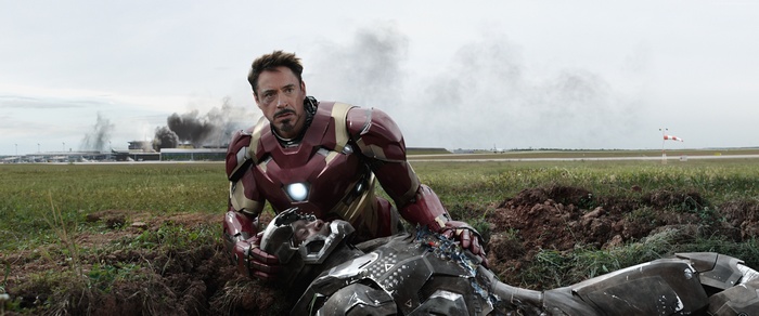 Iron Man holding War Machine from Captain America: Civil War