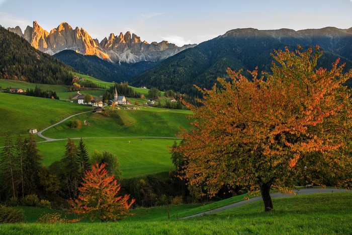 Autumn landscape with mountains and a village