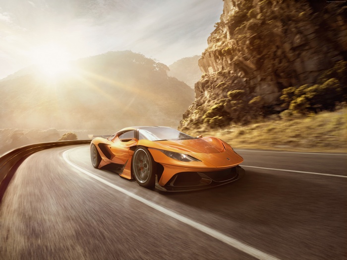 Orange Apollo Arrow Hypercar on a Mountain Road