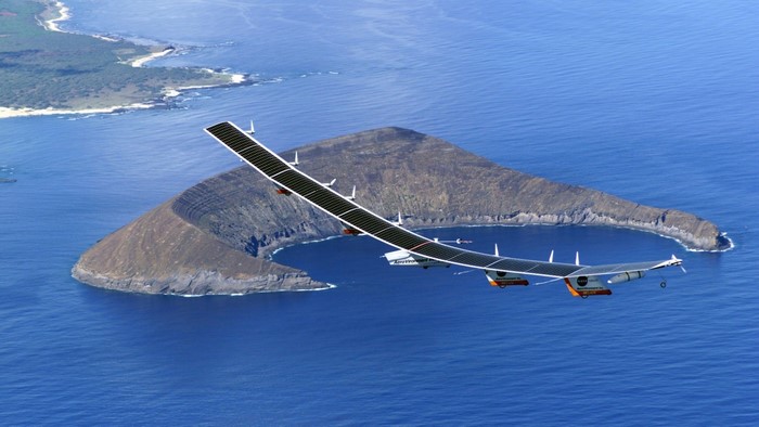 Solar Impulse airplane flying over islands and ocean