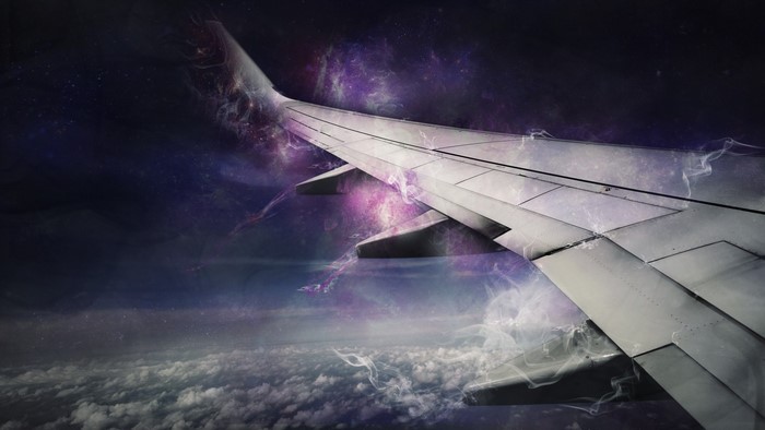 Airplane wing flying through a galaxy