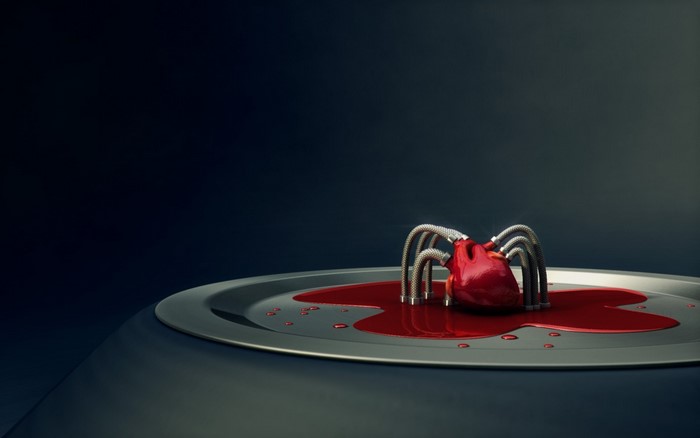 Mechanical heart on a platter with blood
