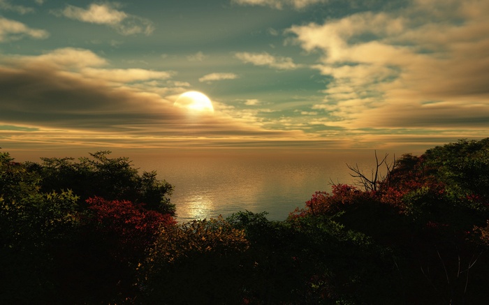 Sunset over the ocean with trees in the foreground