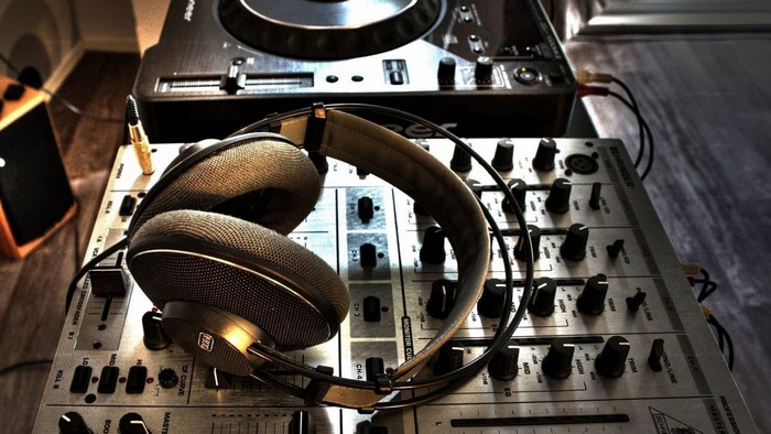 DJ headphones on a mixer and turntable