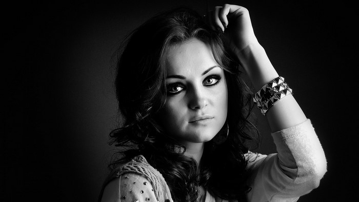 Monochrome portrait of a woman with dramatic makeup
