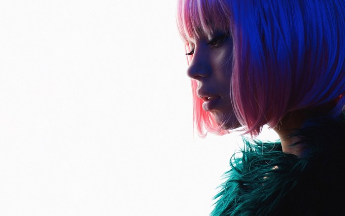 Woman with pink and blue hair and green fur