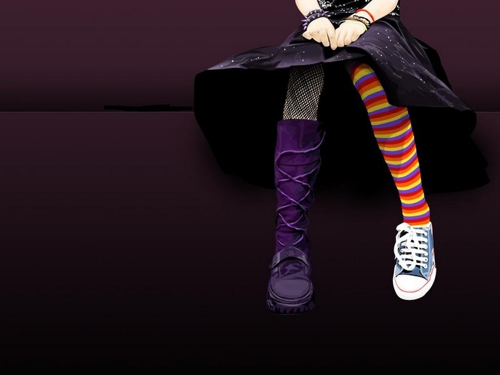 Person wearing mismatched socks and boots