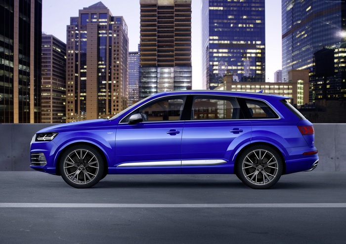 Blue Audi SQ7 TDI parked in a city at night