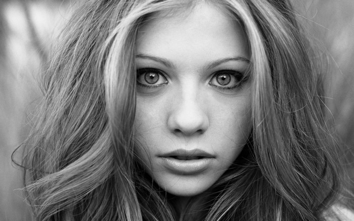 Monochrome portrait of a young woman with long blonde hair