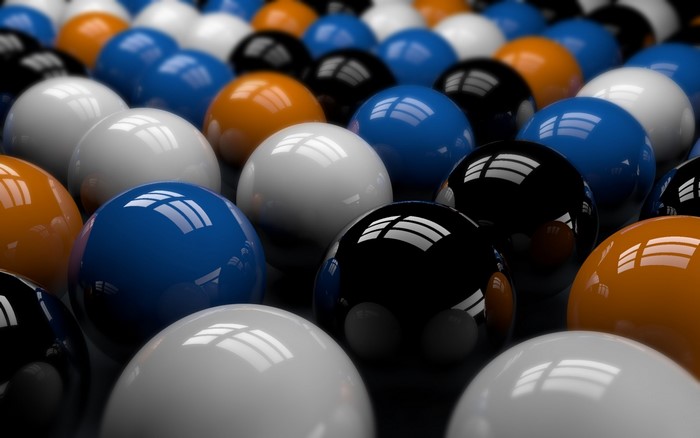 Close-up of billiard balls on a dark surface