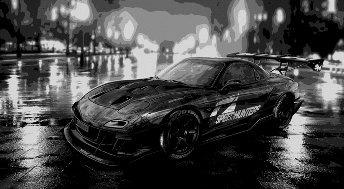 Black sports car with Speedhunters livery on wet street