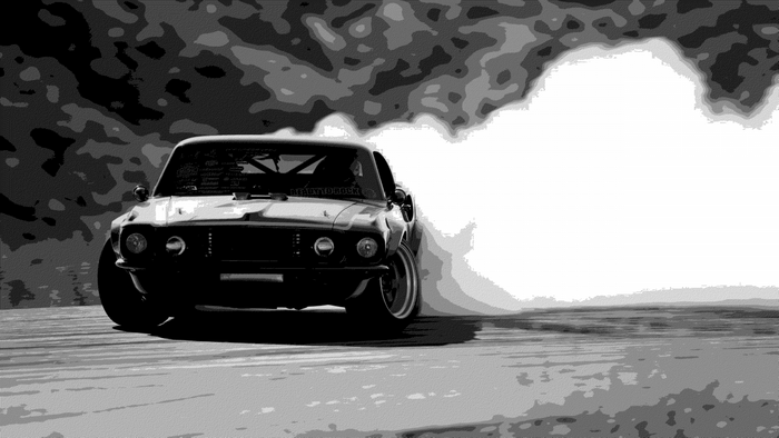 Black muscle car drifting and creating smoke