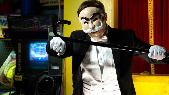 Mr Robot character with mask and cane