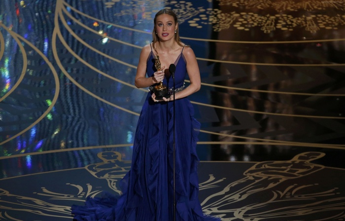 Brie Larson holding an Oscar award at the Oscars 2016
