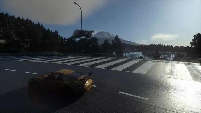Yellow supercar on a road with Mount Fuji in the background