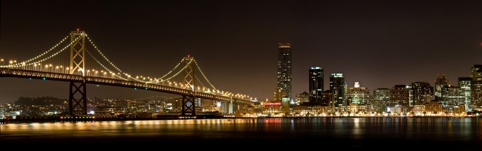 Oakland Bay Bridge and San Francisco skyline at night