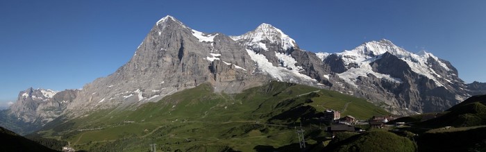 Panoramic view of the Eiger, Mönch, and Jungfrau mountains in the Swiss Alps