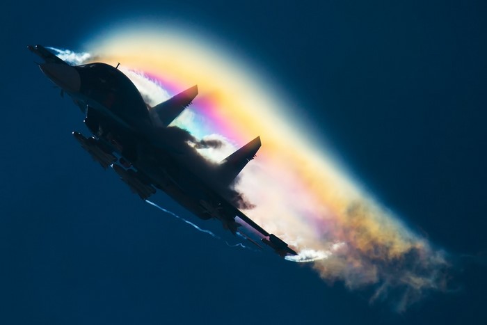 Sukhoi Su-34 fighter jet with rainbow contrail