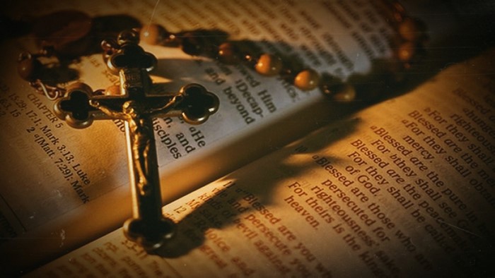Crucifix and Rosary on Holy Bible