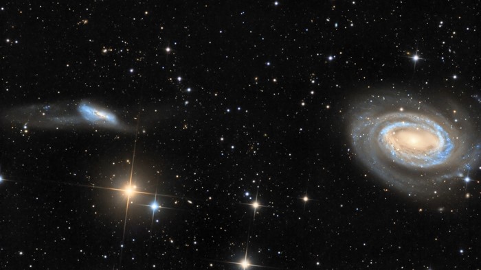 Two galaxies and stars in outer space