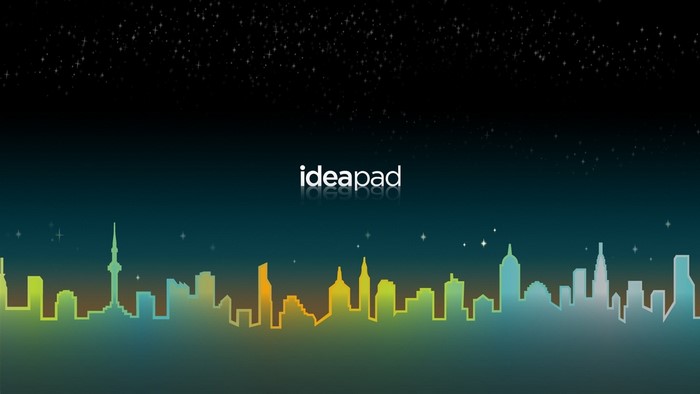 Lenovo Ideapad logo over a colorful city skyline at night