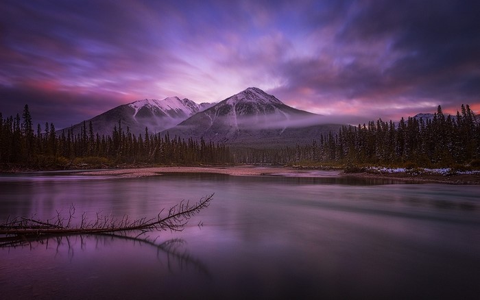 Purple Sunset Over Snowy Mountains and River
