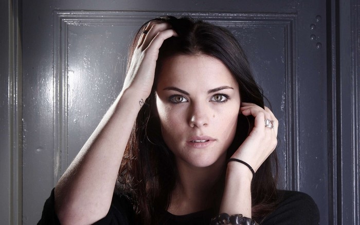 Jaimie Alexander portrait with hands in hair