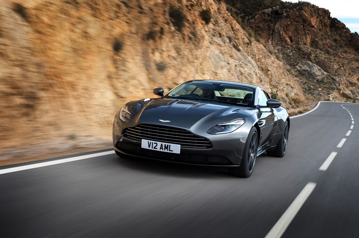 Aston Martin DB11 driving on a winding road