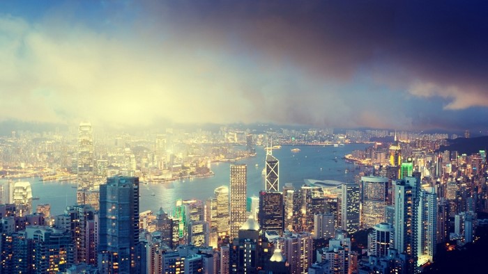 Hong Kong cityscape at dusk with harbor and skyscrapers