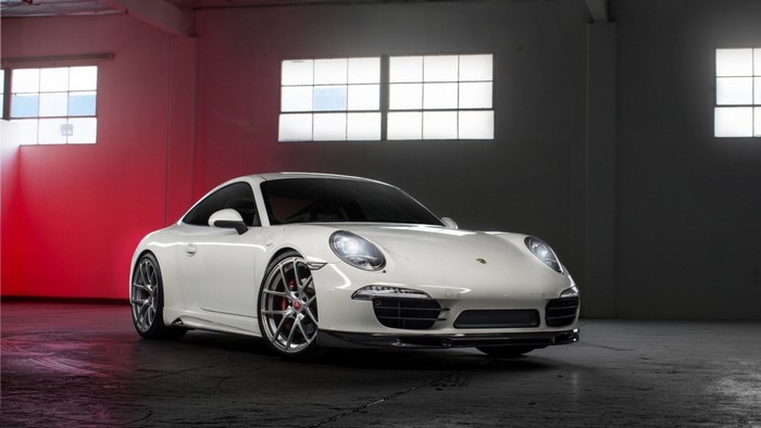 White Porsche 911 sports car in a studio
