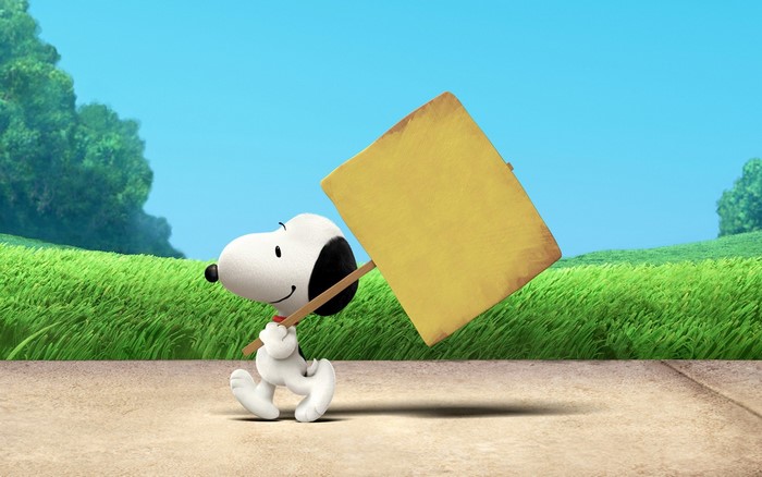 Snoopy from Peanuts comic holding a blank sign