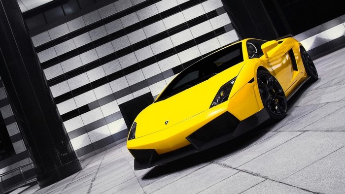 Yellow Lamborghini Gallardo parked in a modern building