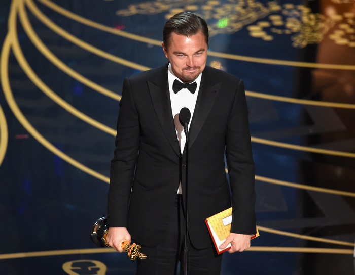 Leonardo DiCaprio holding Oscar award at Oscars 2016
