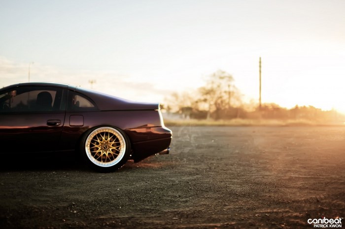 Nissan 300ZX with gold rims at sunset