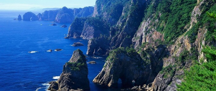 Rugged coastline with steep cliffs and blue sea