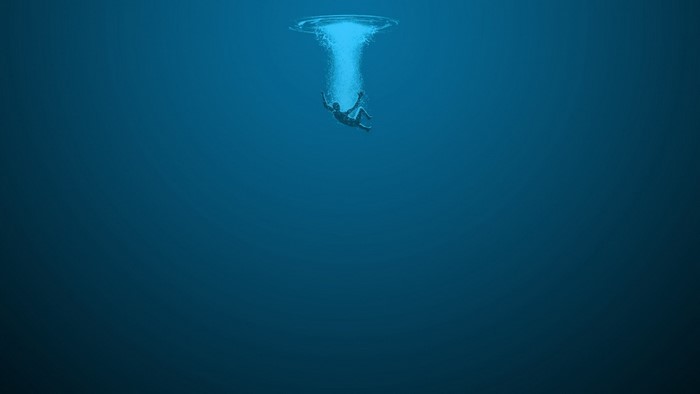 Person falling into deep blue ocean water