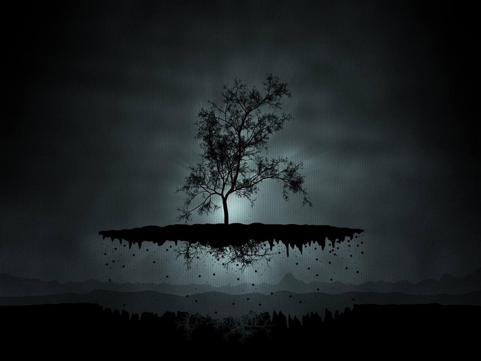Silhouette of a tree on a floating island at night