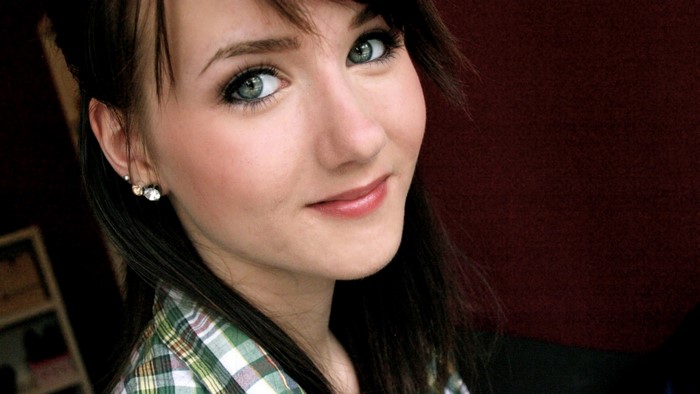 Woman with green eyes and plaid shirt