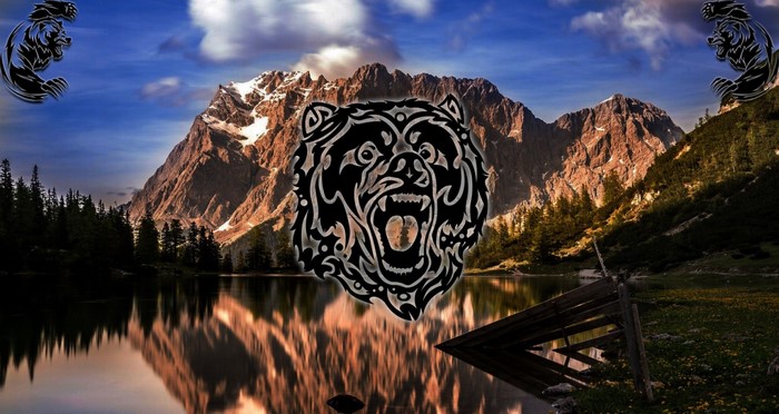 Tribal bear graphic over mountain lake landscape