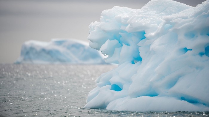 Close-up of a blue iceberg in the ocean